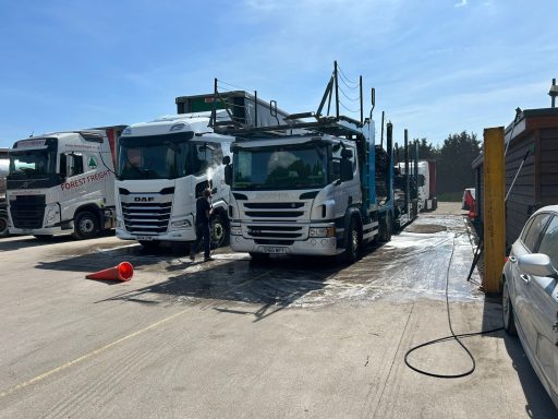 Commercial vehicles lined up after professional cleaning