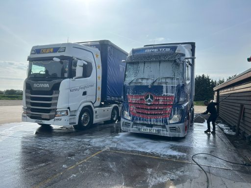 Two commercial trucks after washing